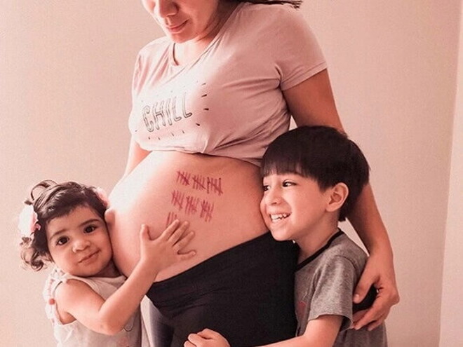 Niños abrazando a su madre